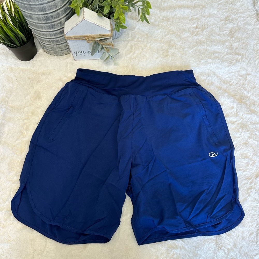 NWT. Women’s dark blue running shorts. Size L.
